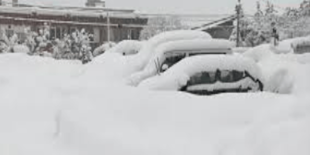 மூழ்கியது அமெரிக்கா பனி மழையில்